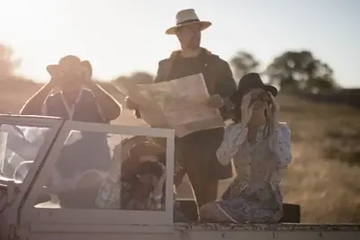 Friends on a safari vehicle